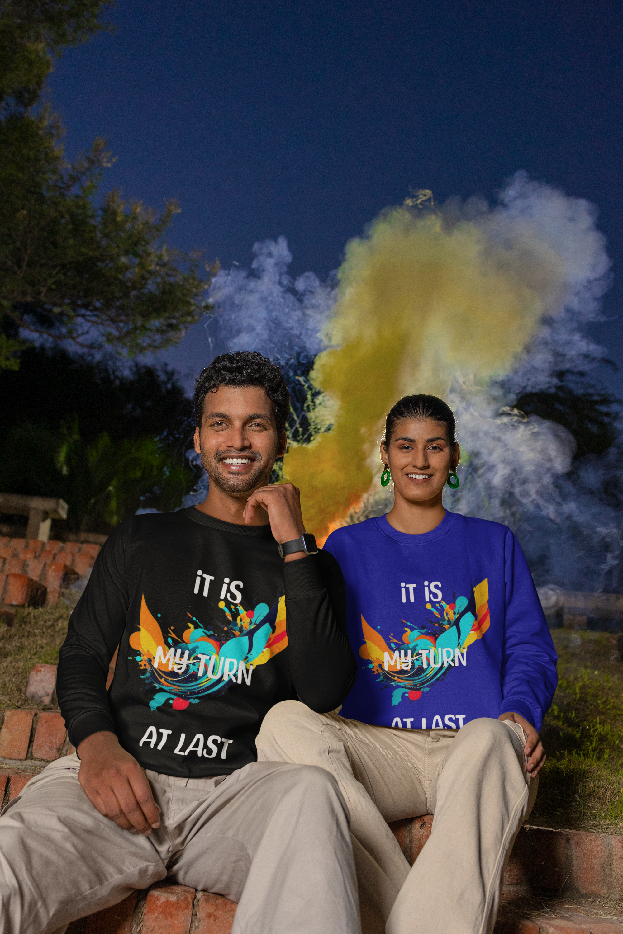 Man and woman sitting together, happy, wearing Sweatshirt with graphic design, IT IS MY TURN AT LAST